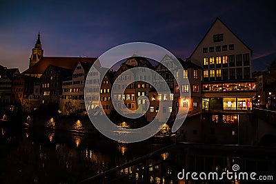 Old houses with luminous windows in the evening Editorial Stock Photo