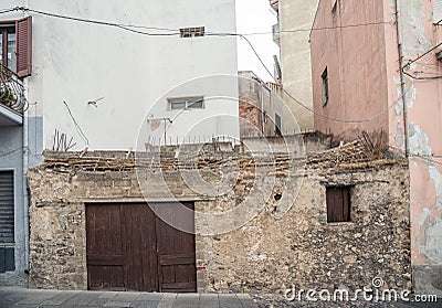 Very old house made of stones, wood, Oliena, Nuoro Province, island Sardinia, Italy Editorial Stock Photo