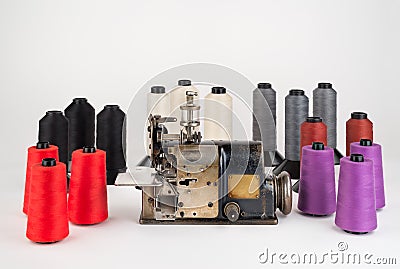 Old Industrial Sewing Machine with Spools of Thread. Stock Photo