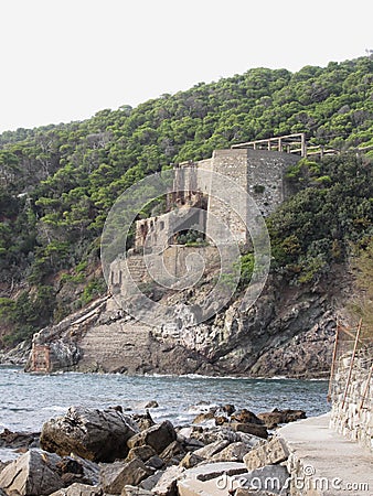 Old industrial structure used in the past to transport limestone from mine to the sea . Livorno, Tuscany, Italy Stock Photo