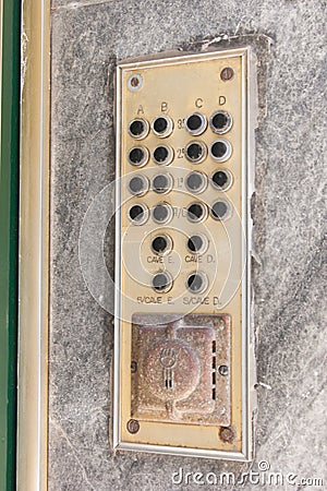 Old intercom on an old wall. Vintage background Stock Photo