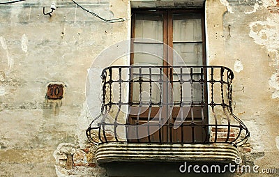 Old iron balcony in an abandoned house Stock Photo