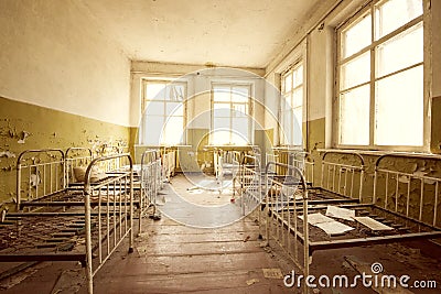 Children`s bedroom of abandoned Kindergarden in Chernobyl Stock Photo