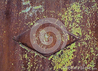 Old iron fence. Old cracked paint. Rust structure. Old vintage door handle. Padlock. Iron gate. Stock Photo