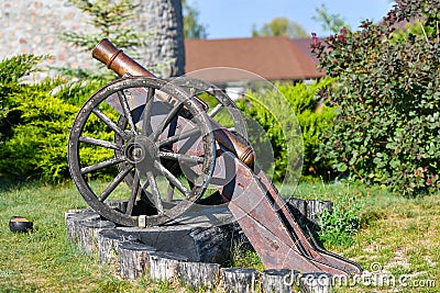 Old iron gun. A cannon that shoots cores. Burning wick. Current model of an old artillery gun. naked gun, cannon on wheels, Editorial Stock Photo