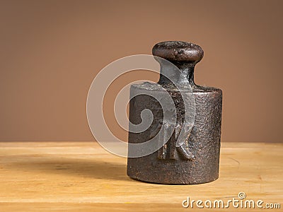 Old iron 1kg weight for a kitchen scale Stock Photo