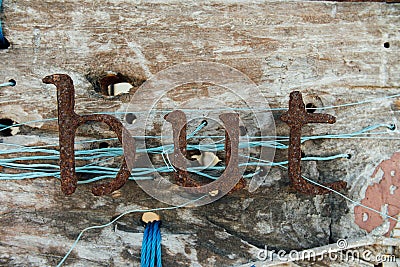 Old iron letters. Vintage signboard with text from iron corrosion letters signs Stock Photo