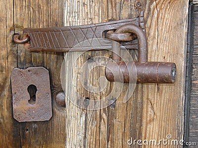 An old iron lock at an old woodhouse Stock Photo