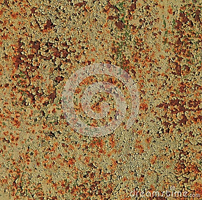 An old iron or metallic surface, background, texture. Yellow wall or plane with peeling and cracked paint Stock Photo