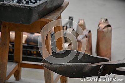 Cencerrps, manufacturing, workshop, old, iron, tongs, cowbell, factory, advertisement, blacksmith, book, cover, cut, danger, fear, Stock Photo
