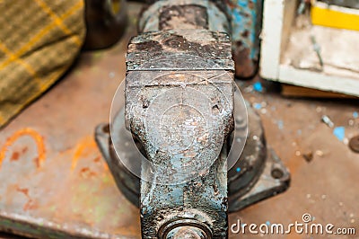 Old iron vise on a shelf in a tool garage Stock Photo