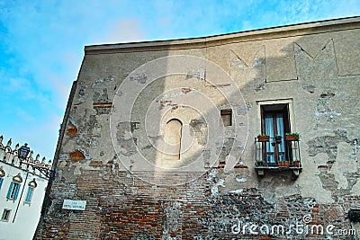 Old damaged building in Italian historic city Verona Stock Photo