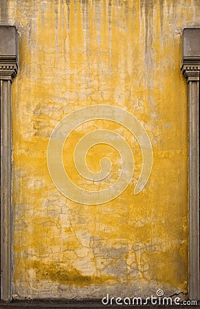 Old Italian Yellow Wall with Posts. Stock Photo