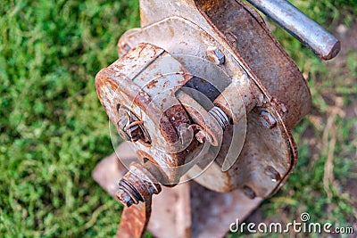 House lifting jack. Old rusty mechanical screw jack Stock Photo