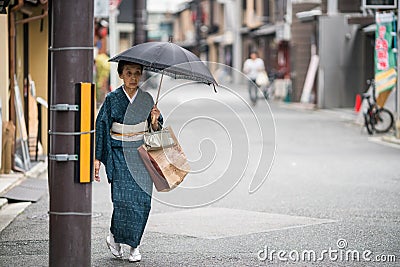 An old Japanese woman in a kimono Editorial Stock Photo