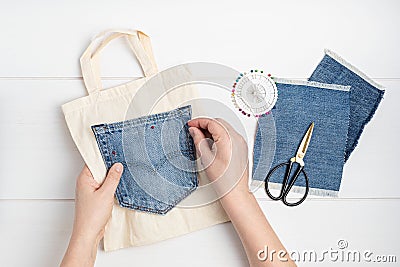 Old jeans upcycling idea. Crafting with denim, recycling old clothers, hobby, diy activity Stock Photo