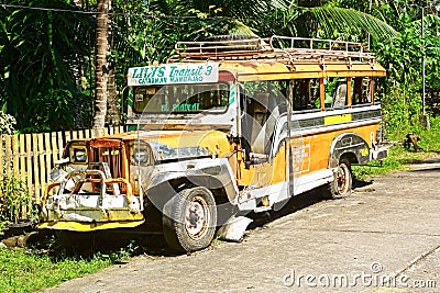 Old Jeepney on a rural road. Editorial Stock Photo