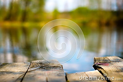 The old jetty on the still water in autumn Stock Photo