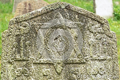 Old Jewish gravestone in the old Jewish cemetery. Star of David on an ancient stone tombstone Stock Photo