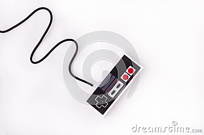 Old joystick on a white background. Video game console GamePad on a white background. Top view Stock Photo