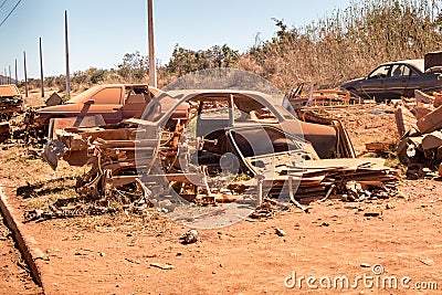 Old Junk Cars left on the side of the Road to deteriorate Stock Photo