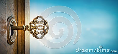 Old key in keyhole on sky background with sun ray . Concept, symbol and Idea for History, business, security background Stock Photo