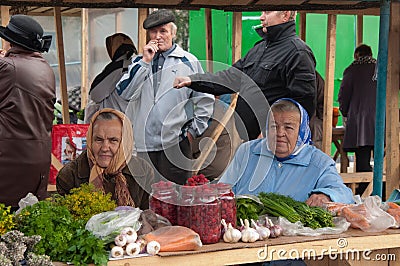 Old ladies selling vegetables on a street market in Irkutsk, Russia Editorial Stock Photo