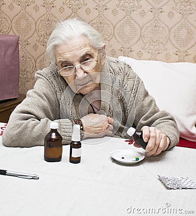 Old lady with medicines Stock Photo