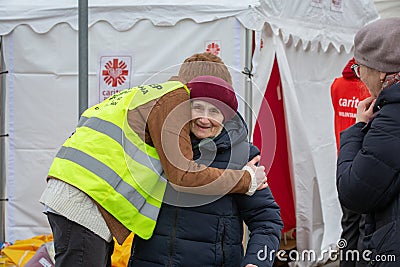 Old lady getting a hug at the Tesco Ukrainian refugee centre Editorial Stock Photo
