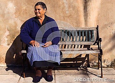 Old lady in a Greek village Stock Photo
