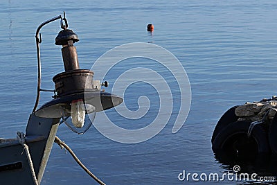 Old lamp for night deep-sea fishing installed on fisherman boat. Stock Photo