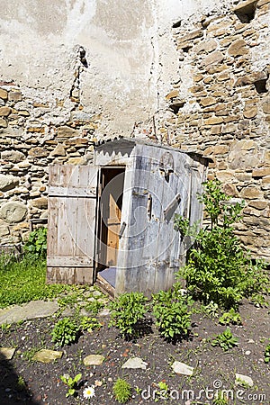 Old latrine building in the back of a old house Stock Photo