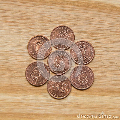 Old Latvian coins on a wooden background Stock Photo