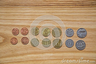 Old Latvian coins on a wooden background Stock Photo