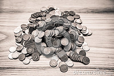 Old Latvian coins on a wooden background - monochrome vintage lo Stock Photo