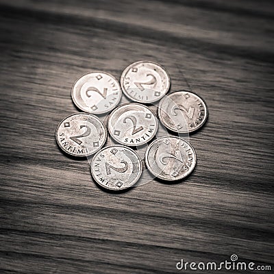 Old Latvian coins on a wooden background - monochrome vintage lo Stock Photo