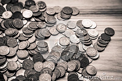 Old Latvian coins on a wooden background - monochrome vintage lo Stock Photo