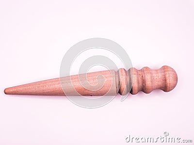 old Leather crafting tool - round wooden Multi-Size Edge Slicker and Burnisher isolated on white background Stock Photo