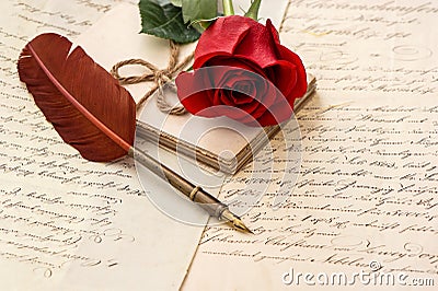 Old letters, rose flower and antique feather pen Stock Photo