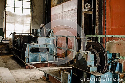 Old lifting gear. winch in old building Stock Photo