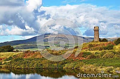 Old lighthouse and Black Combe near Millom. Stock Photo