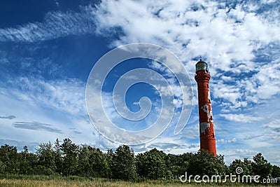 The old lighthouse standing on the shore in Paldiski Stock Photo
