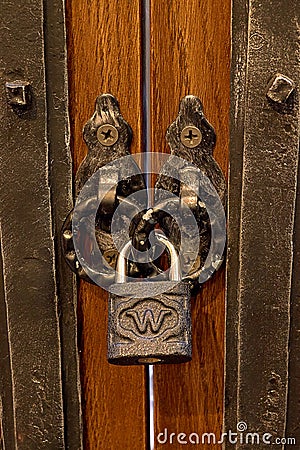 The old lock on a wooden door for print Stock Photo