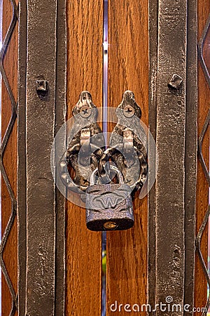 The old lock on a wooden door for print Stock Photo