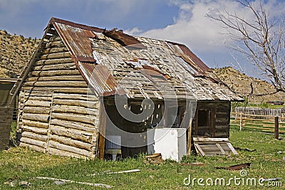 Old rural log barn garage junk Stock Photo