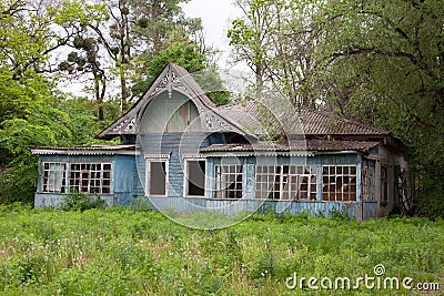 Old lonely wooden house with broken windows Stock Photo