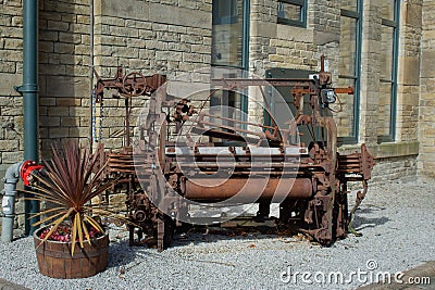 An old loom used to decorate a courtyard Stock Photo