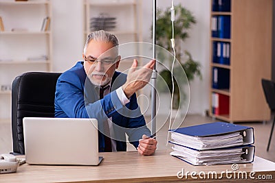 Old male employee in blood transfusion concept Stock Photo