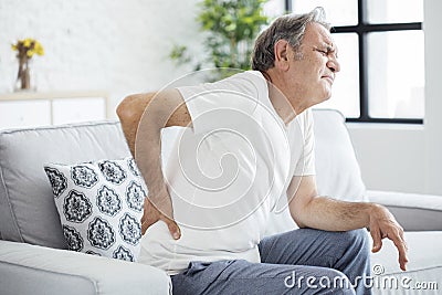 Old man with back pain Stock Photo