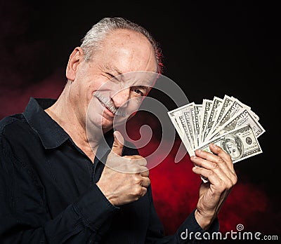 Old man with dollar bills Stock Photo